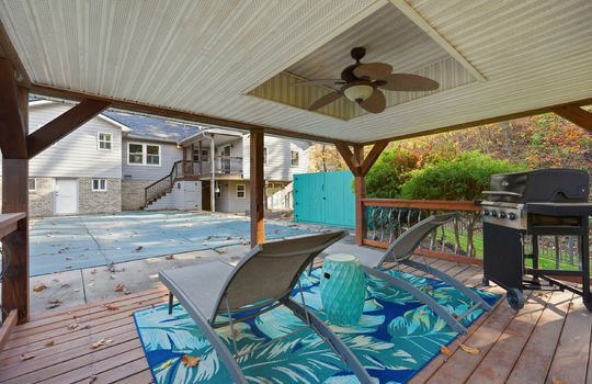 gazebo, ceiling fan, view toward pool and back of home, landscaping, fencing