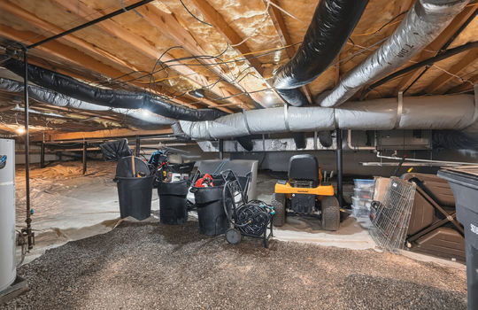 basement, unfinished, storage area, gravel flooring