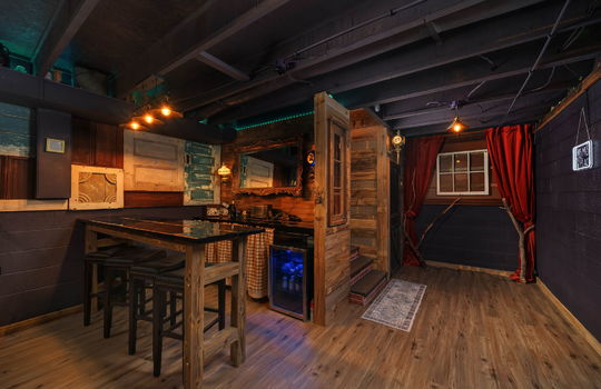 lower level speak easy space, luxury vinyl flooring, wood walls, block walls