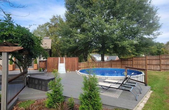 back yard summer view, swimming pool, fencing, landscaping, pergola