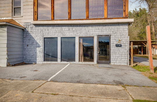 ground level apartment for lease, glass front door, glass windows, wood siding