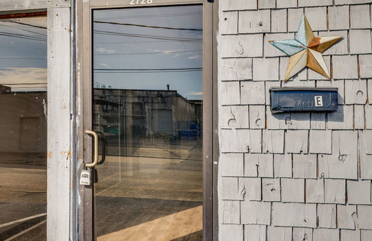 Front door, glass front door, wood siding