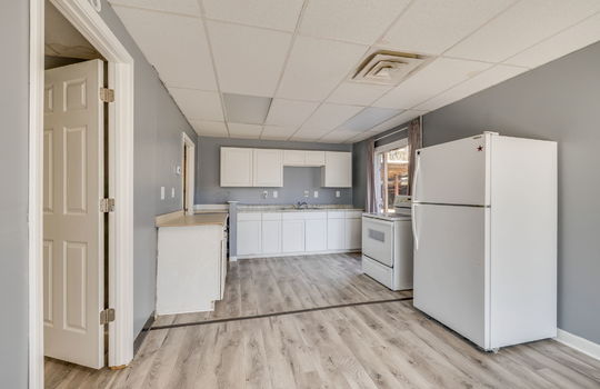 kitchen, electric range, refrigerator, sink, cabinets, countertops, window, doorways