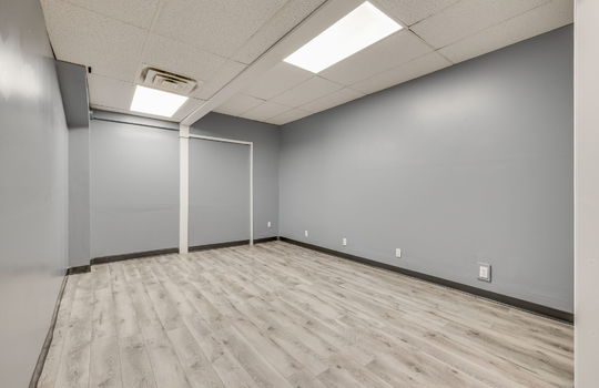 bedroom, luxury vinyl flooring, fluorescent lighting, ceiling tiles