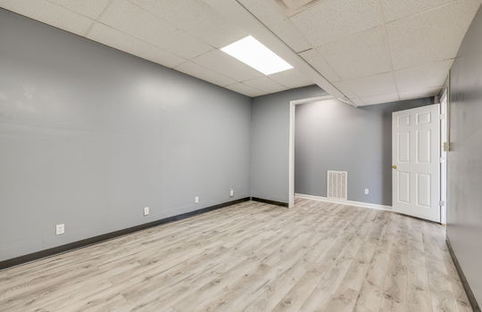 bedroom, luxury vinyl flooring, fluorescent lighting, ceiling tiles