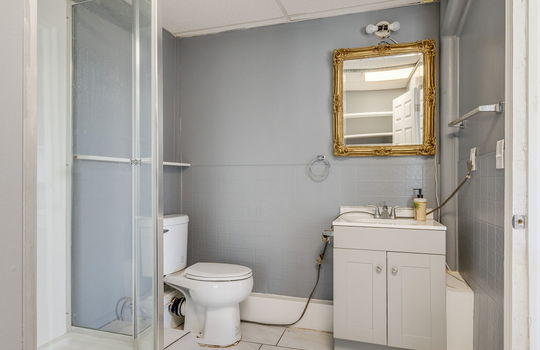 bathroom, toilet, shower, sink, tile flooring