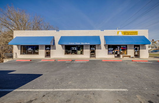 strip mall exterior, parking lot, block exterior