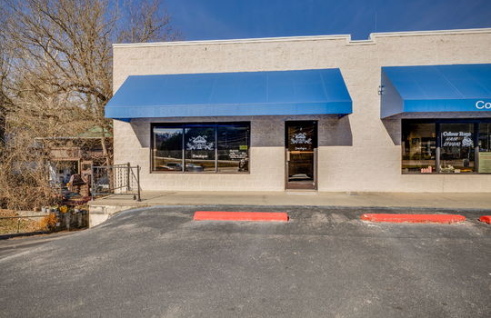 strip mall exterior, parking lot, block exterior, commercial space for lease, storefront