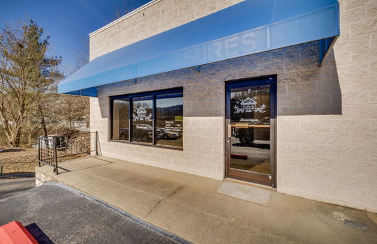 strip mall exterior, parking lot, block exterior, storefront