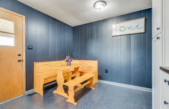 Eat-In Kitchen area, back door, paneling walls