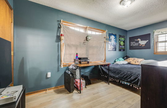 bedroom, luxury vinyl flooring, windows, closet