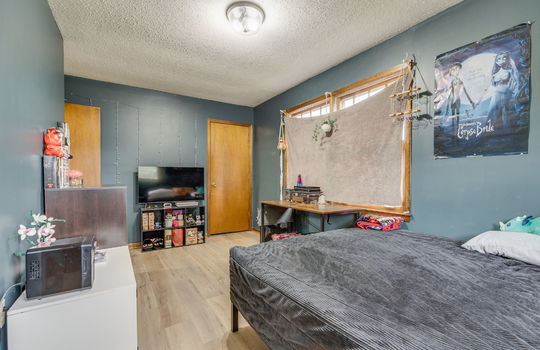 bedroom, luxury vinyl flooring, closet, windows