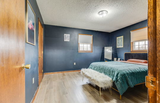 bedroom, luxury vinyl flooring, windows, closet