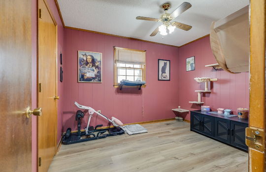 third bedroom, closet, luxury vinyl flooring, window, ceiling fan