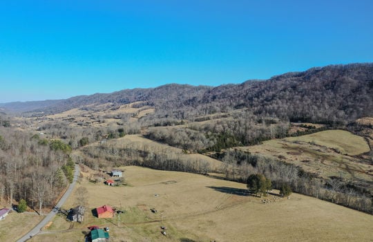 aerial view of nearby mountains, mountain views, neighboring homes