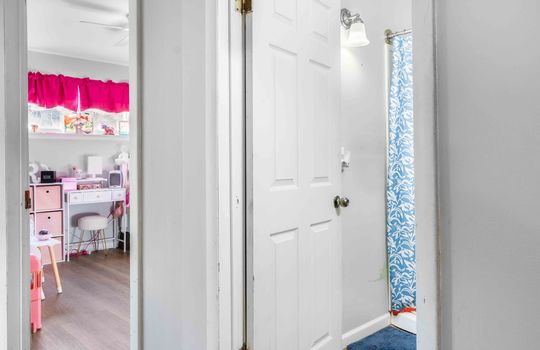 hallway view toward bedroom and bathroom doorways