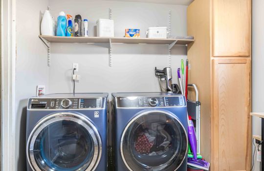 laundry room, washer/dryer hookups, cabinet, shelving