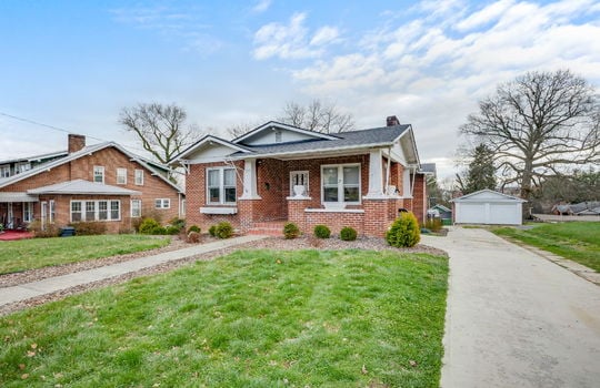 bungalow, brick, covered front porch, front door, driveway, front yard