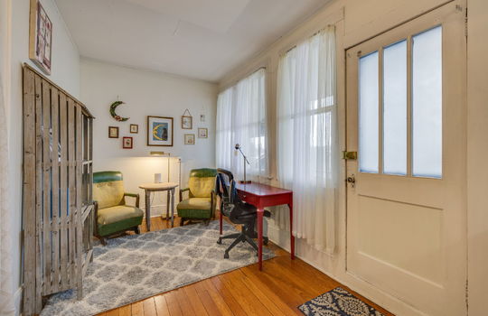 Office/sitting area, hardwood flooring, exterior door, windows