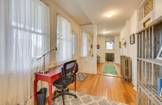 office/sitting room/ hallway to kitchen, windows, exterior doors, hardwood flooring, radiator