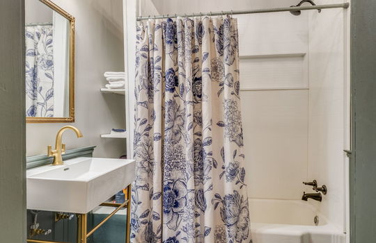 bathroom, tile flooring, sink, toilet, tub/shower