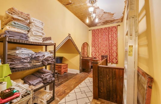 upper level storage area, hardwood flooring, window, stairs, nook