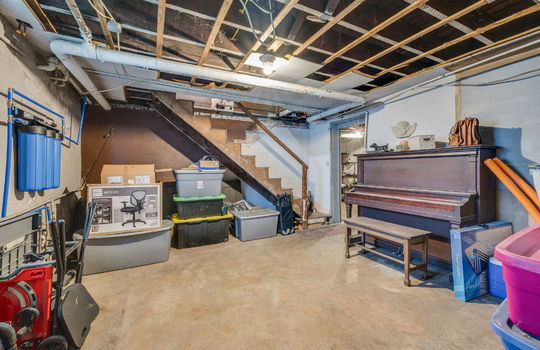 basement, concrete flooring, stairs