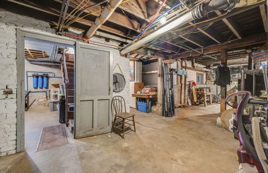 basement concrete flooring, storage space, stairs to main level
