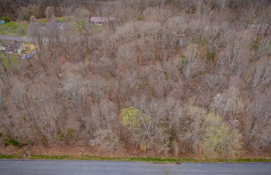 aerial photo, land for sale, 1.09+/- acres, road, trees, neighboring properties