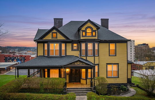 Victorian Home, Wood Siding, wrap-around porch, landscaping, covered porch, nearby businesses, windows, front door, chimney