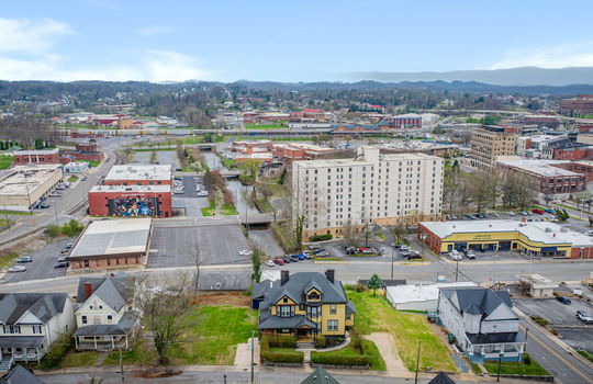 aerial view of home and surrounding Bristol homes and views, mountains, Downtown Bristol businesses, roads