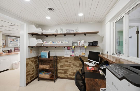 reception area, stone wall design, reception window, reception desk, storage shelves