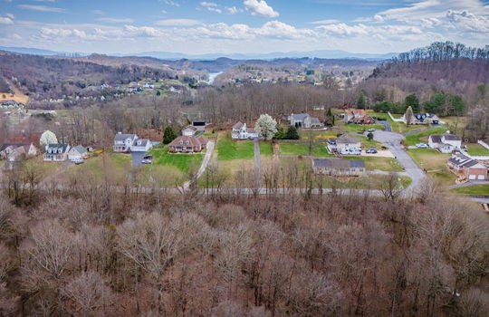 aerial photo, land for sale, 1.09+/- acres, road, trees, neighboring properties