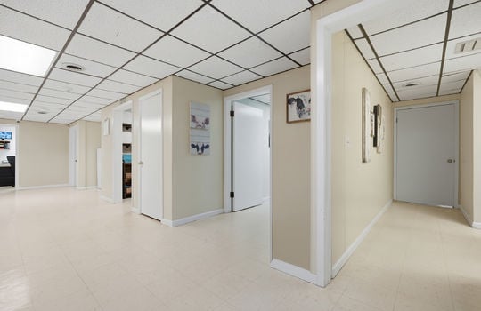 hallway, doors to exam rooms, tile flooring