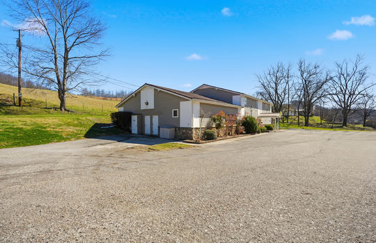 Veterinary Hospital for Sale, 9787 SqFt, 1.95+/- acres, parking lot, metal siding, vinyl siding, stone, covered entryway, front entryway, parking lot, side entry, trees
