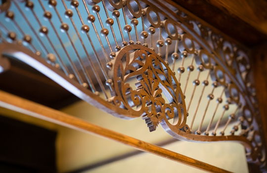 ornate wood and metal detailing in doorway