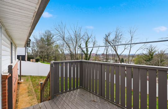 back deck, stairs to back yard, brick, vinyl siding, fenced back yard, mountain views