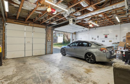 garage, concrete flooring, garage doors