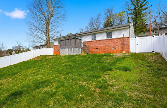 back of home, fencing, back deck, brick, vinyl siding, back yard