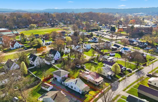 aerial view, apartment, property outline, neighboring homes, street, sidewalks, mountain views