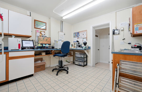 office, workstation, storage cabinets, sink, fluorescent lighting