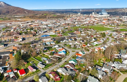 overhead aerial view of property, apartment, driveway, neighboring homes, neighborhood view, mountain views