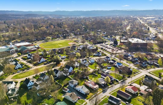 overhead aerial view of property, apartment, driveway, neighboring homes, neighborhood view, mountain views