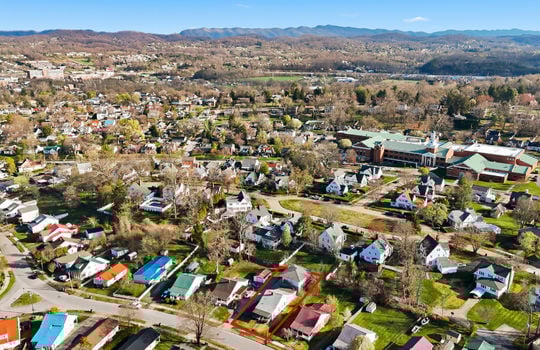 aerial view, apartment, property outline, neighboring homes, street, sidewalks, mountain views