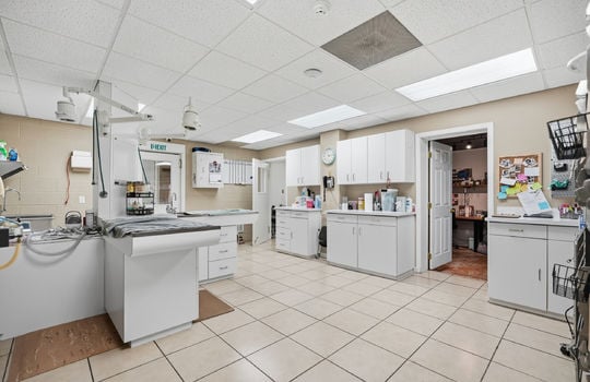 inner office area, grooming area, tile flooring, storage cabinets