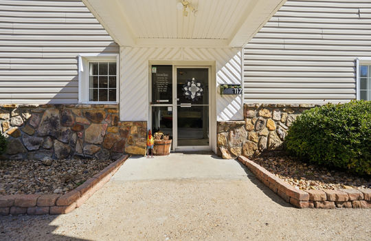 entryway, landscaping, glass door entry, covered entryway, vinyl siding, metal siding, stone