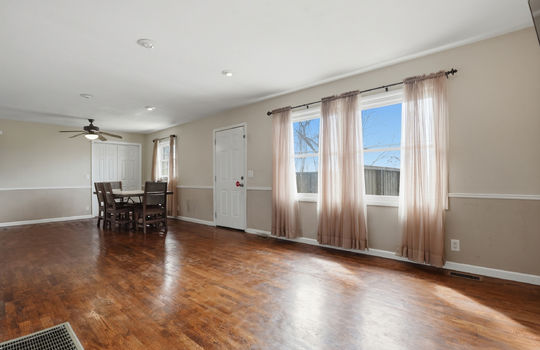 living room, dininga rea, exterior door, windows, hardwood flooring, ceiling fan, recessed lighting, closet