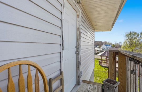 front door, deck, vinyl siding
