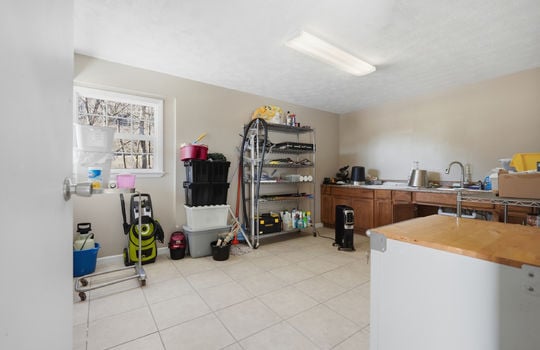banr office area, sink, storage cabinets, flourescent lighting