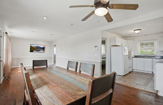 living room/dining area, open view into kitchen, hardwood flooring, recessed lighting, ceiling fan, kitchen with tile flooring